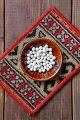 Traditional oriental appetizer kurt on a wooden background 