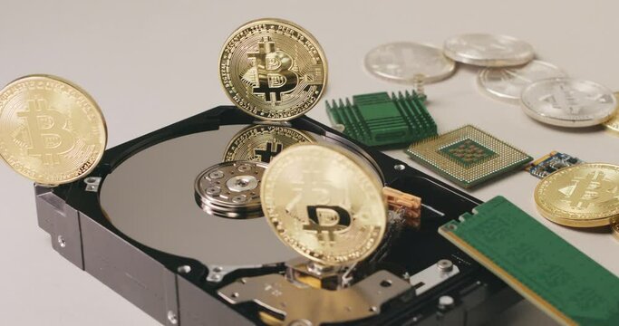 Bitcoin coins with computer parts, crypto mining and blockchain concept. Modern financial technologies