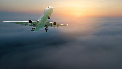 Passengers commercial airplane flying above clouds, detailed view of wing. Concept of fast modern travel