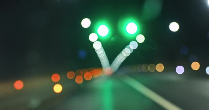 Shot of colorful light spots in the tunnel from a moving car