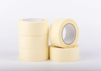 masking tape stands on a white background. adhesive paint protection tape. Painters and people who...