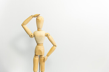 wooden mannequin touching it's head