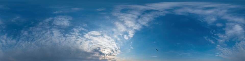 Blue sky panorama with Cirrus clouds in Seamless spherical equirectangular format. Full zenith for use in 3D graphics, game and editing aerial drone 360 degree panoramas for sky replacement.