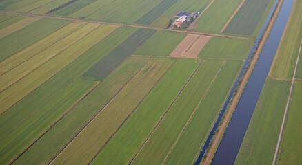 Obraz premium Agricultural landscape of Friesland, one of the northern provinces of the Netherlands - Friesland from above - Local farm
