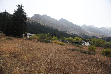 Fototapeta premium Almaty / Kazakhstan - 09.15.2014 : Old dilapidated buildings made of wood for lost tourists in the mountains and a temporary base for mountaineers-rescuers.