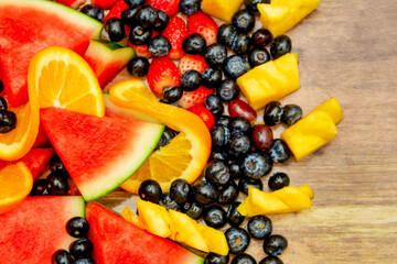 Fresh fruits concept, Healthy mix assorted fruits consist of tropical fruit and berry as background