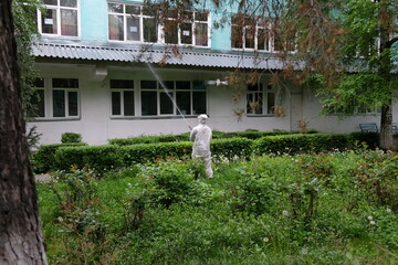 Almaty / Kazakhstan - 05.02.2020 : The military carries out disinfection on the territory of the hospital. Coronavirus quarantine.