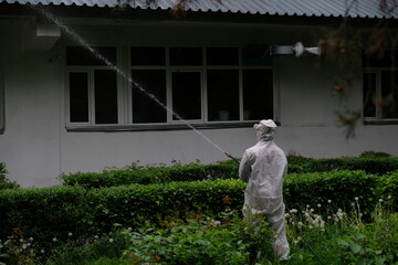 Almaty / Kazakhstan - 05.02.2020 : The military carries out disinfection on the territory of the hospital. Coronavirus quarantine.