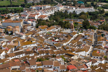 Fototapeta premium whitewashed village of Jimena de la Frontera high angle view with rooftops and church
