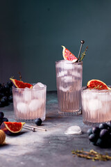 non alcoholic beverage with ice, figs and thyme garnish