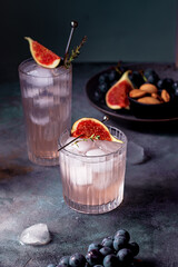 non alcoholic beverage with ice, figs and thyme garnish