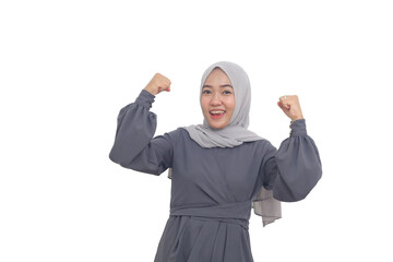 Fototapeta premium Wow and surprised asian muslim woman standing while clenching both hands. Isolated on white