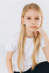 Young blondie girl portrait. Natural blondie hair, happy smiling caucasian girl on white background