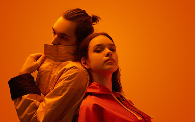 Cool couple in studio with orange light