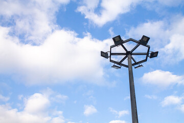 LED Circular light pole on sky background with copy space on the left