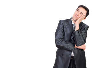 Dreamy man in formal suit touching face