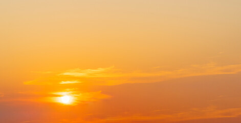 Fototapeta na wymiar sunset orange evening sky with fluffy clouds background