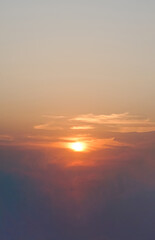 sunset orange evening sky with fluffy clouds background