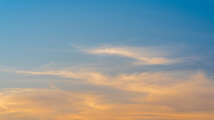Naklejka na ściany i meble sunset evening sky with fluffy clouds