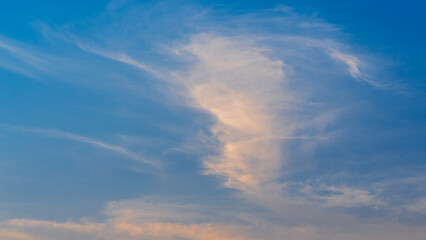 Naklejka na ściany i meble sunset evening sky with fluffy clouds
