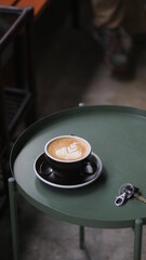 Coffee latte close up on rustic wood table