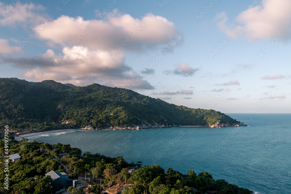 Wall mural wiew of a beautiful bay with a beach at sunset