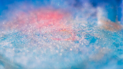 Liquid paint art. Macro ink background. Blue pink white colors mix