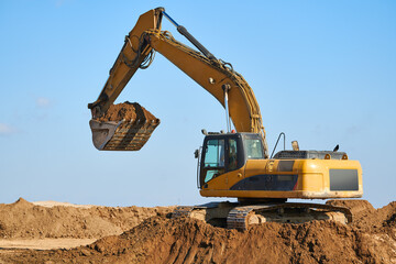 excavator at sandpit during earthmoving works