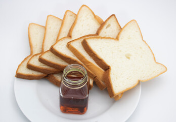 sliced bread with honey isolated on white background