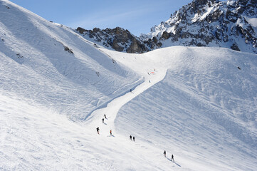 Fototapeta na wymiar ski resort with it’s ski slopes in winter 