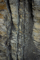 Natural dark background. Detail of the dolomite rock. Vertical image.