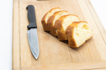 Pound cake on cutting board isolated on white background,