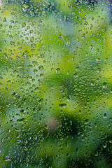 Water drop or Rain drop on glass, Water droplets on frosted glass walls or translucent windows get wet from the rain in the rainy season. 