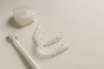 Toothbrush, Mouthpiece and dental floss on a white background