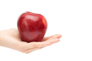 Red apple on the hand isolated on white background