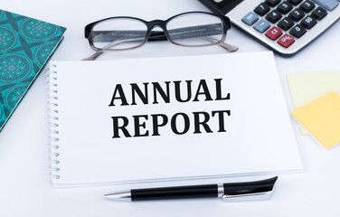 Notepad with text Annual Report. Business concept