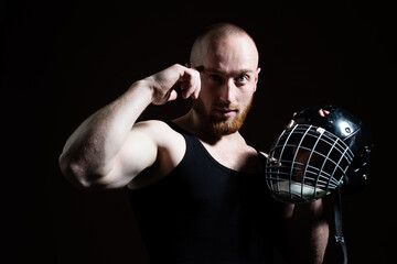 Sexy man with protective helmet on black.