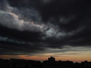Dark Clouds Above City Silhouette