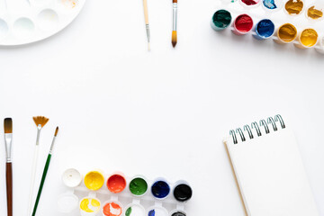 Flat composition set of artistic tools. Brushes, paints, pencils, pastels for drawing. Place for text.