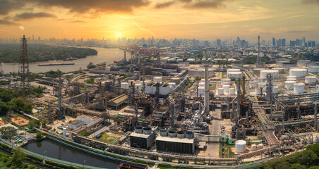 Fototapeta na wymiar Aerial view panorama image of oil and gas industry refinery and petrochemical plant against urban scene in sunrise