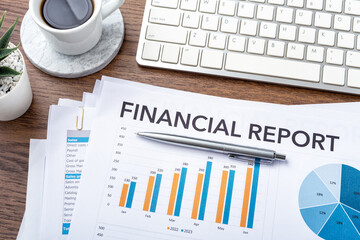 Financial statement review concept with pen on financial report and accounting document