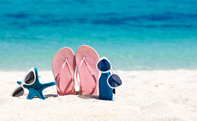 Accessories in the summer holiday  on the sand beach background -Travel concept