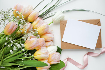 greeting card design. bouquet of tulips on a white background and space for text 