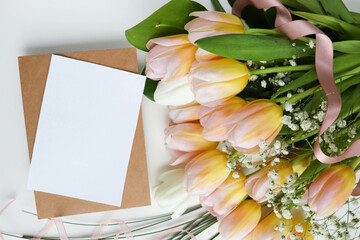 greeting card design. bouquet of tulips on a white background and space for text 