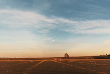 Fototapeta na wymiar Rural landscape, moonrise. sunset on the road