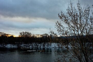 river bank on a cloudy winter day