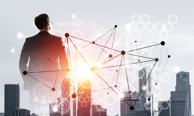 Concept of business success and control with confident boss against cityscape background