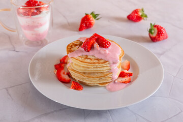 Strawberry pancakes on a white background.