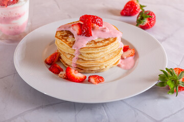 Strawberry pancakes on a white background.