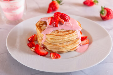 Strawberry pancakes on a white background.